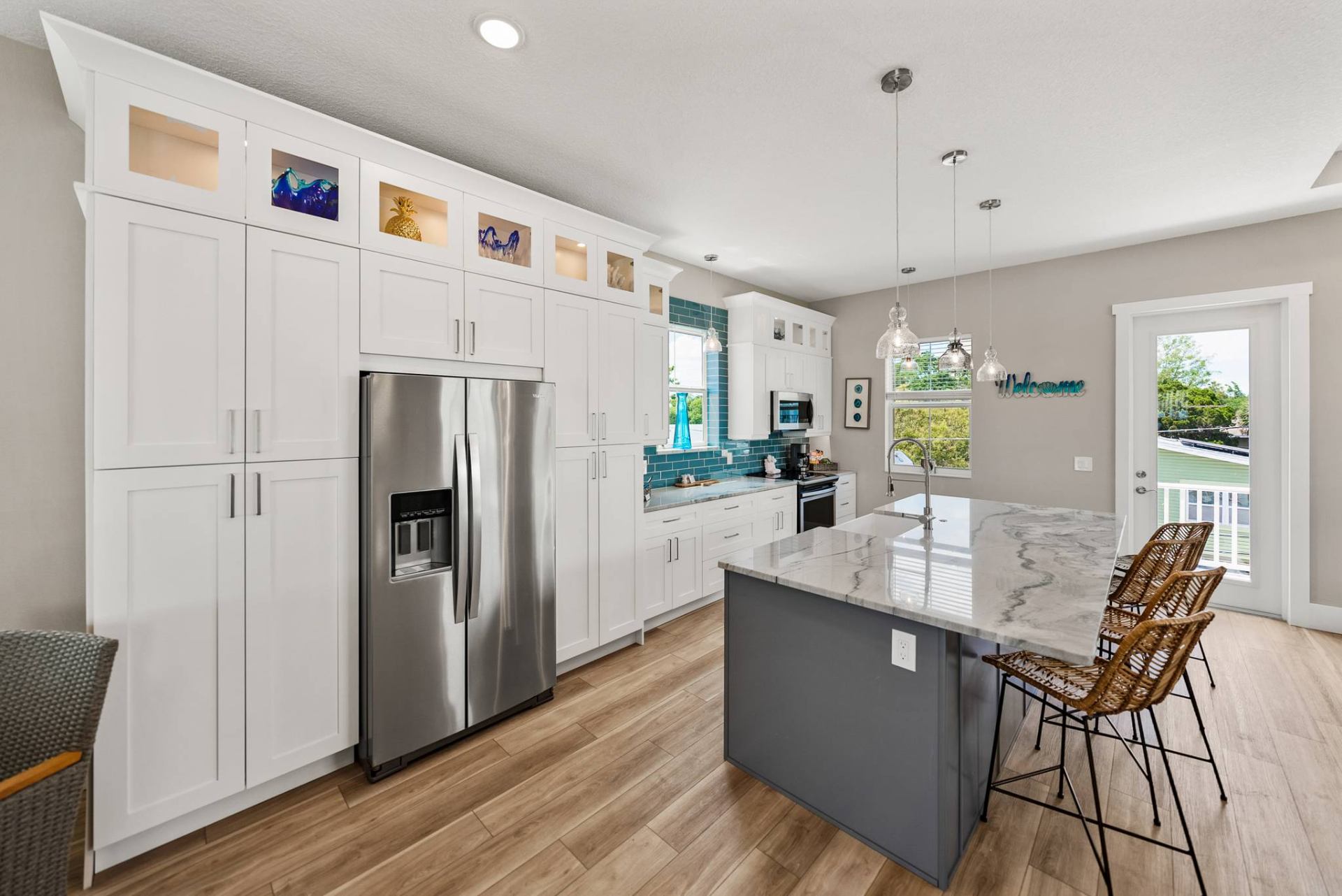 Kitchen with floor-to-ceiling cabinetry and welcome nook