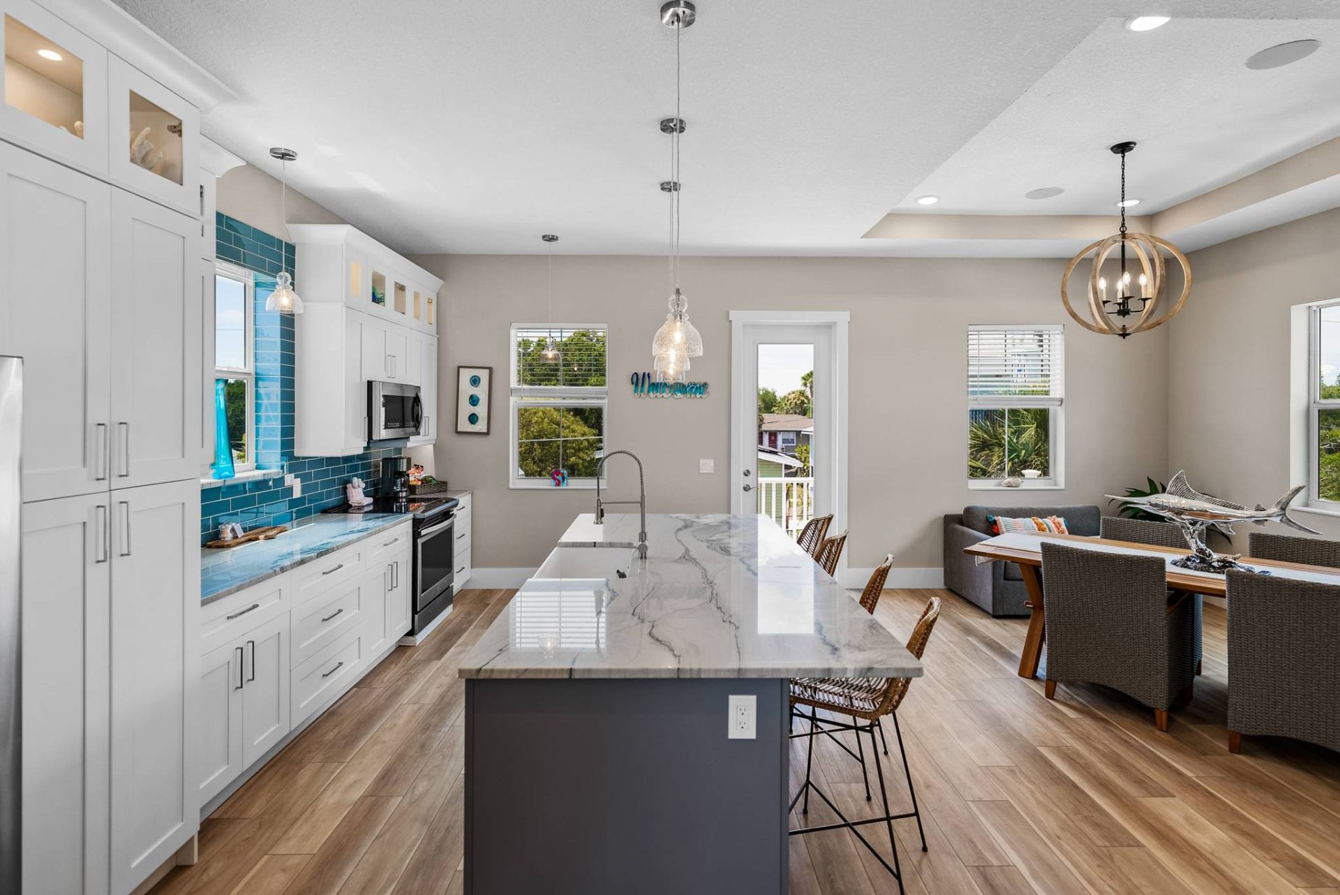 Designer kitchen open to the dining and lounge nook