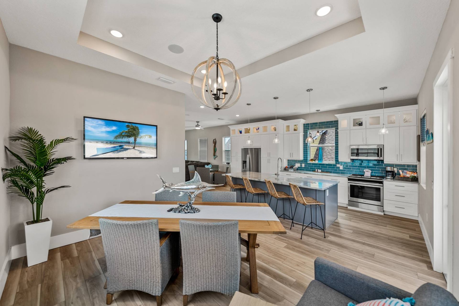 Dining table and kitchen open to the living area