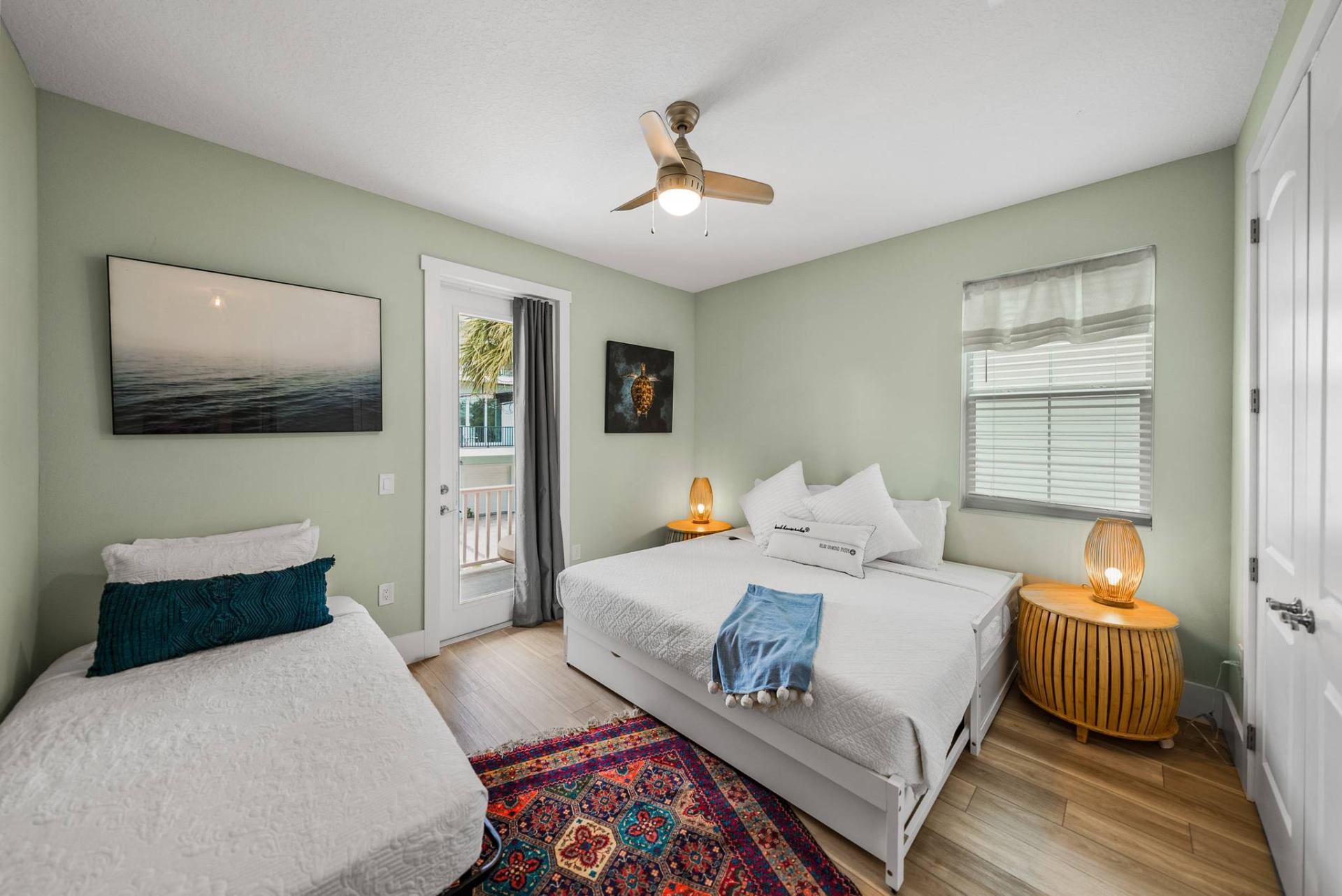 Sage green guest bedroom with king and twin beds