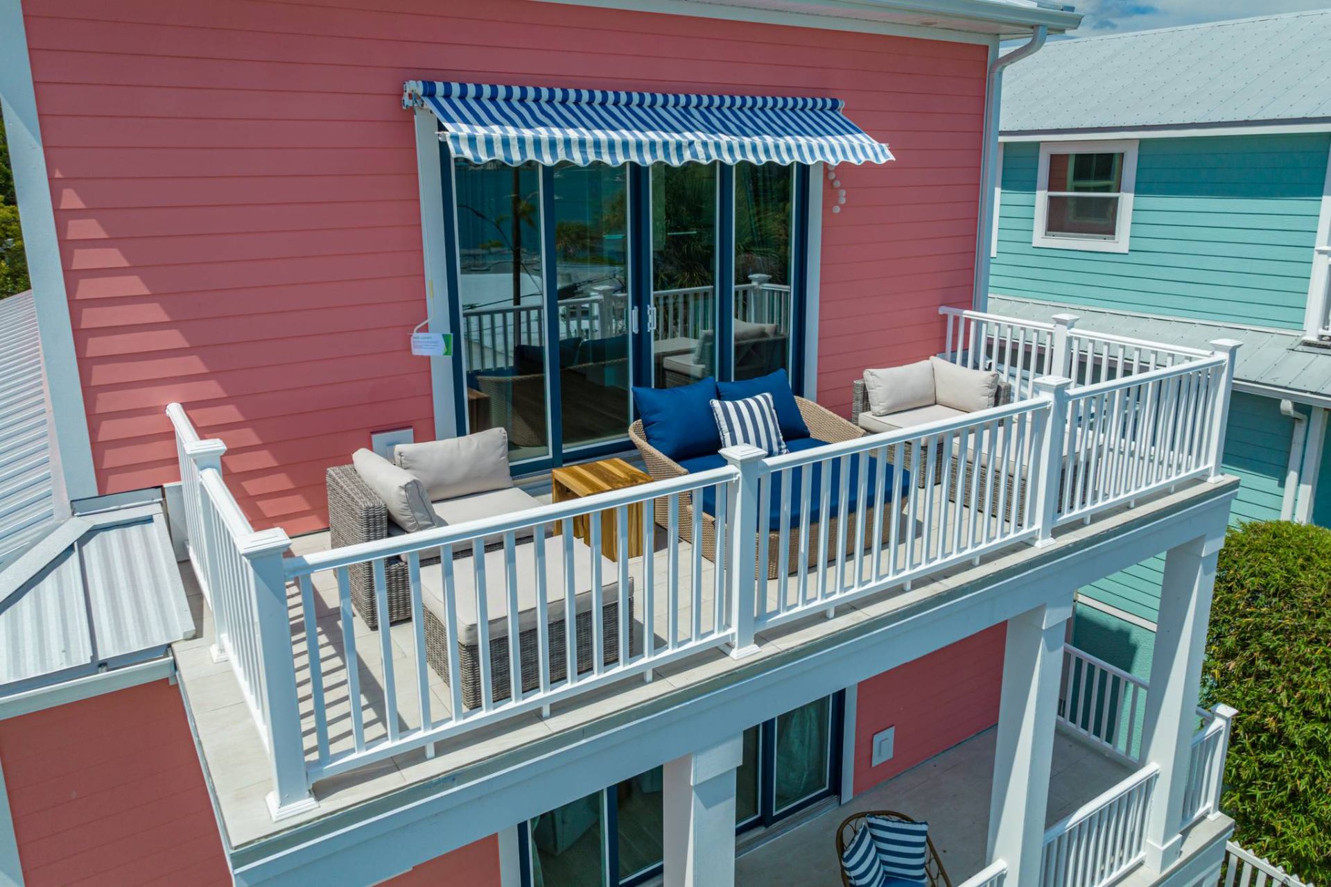 Upper balcony lounge with striped awning
