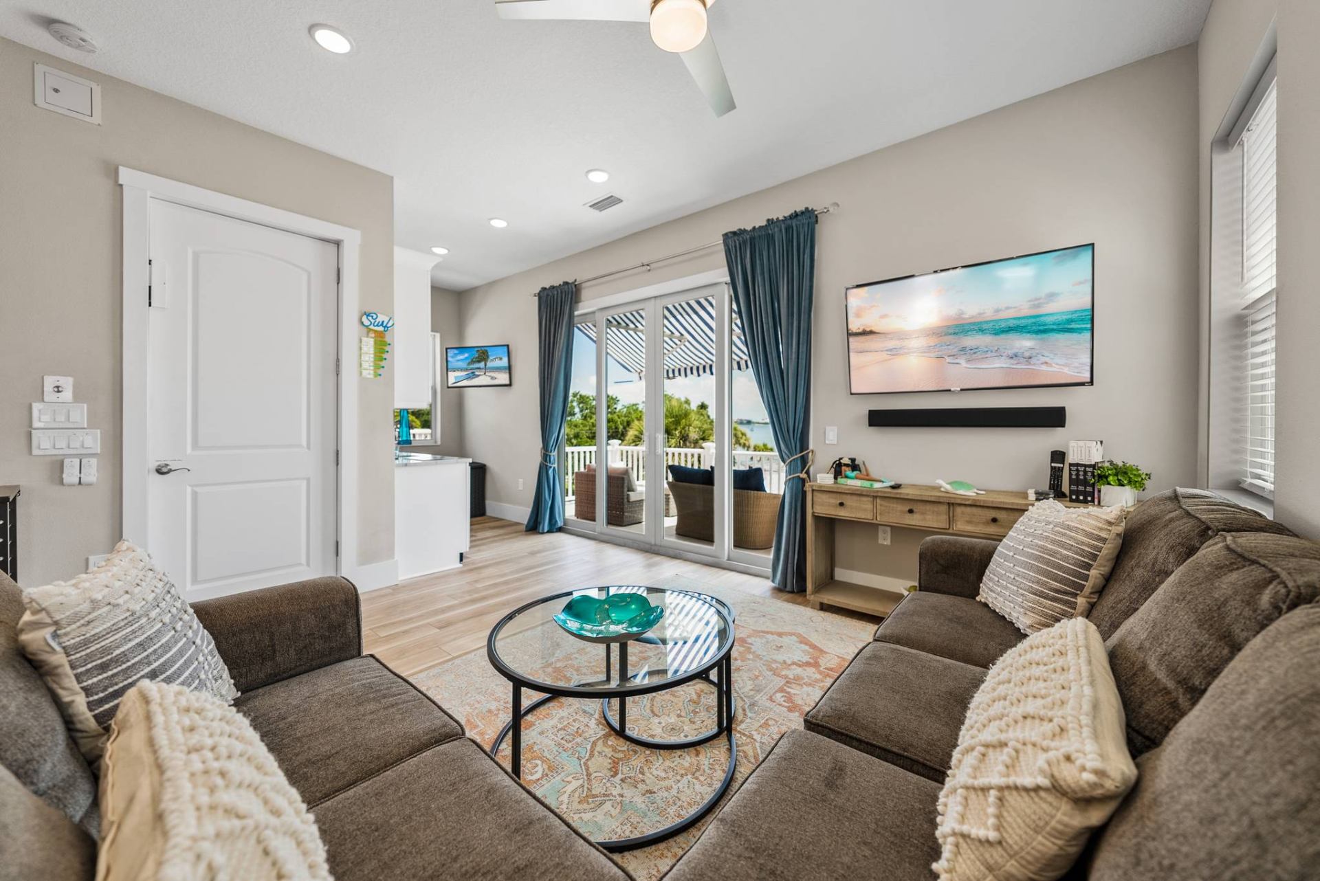Living area with bay-view balcony access